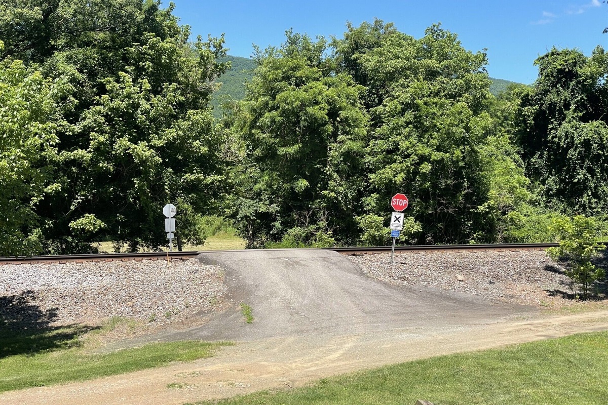 Cross over the railroad tracks here to access the river area
