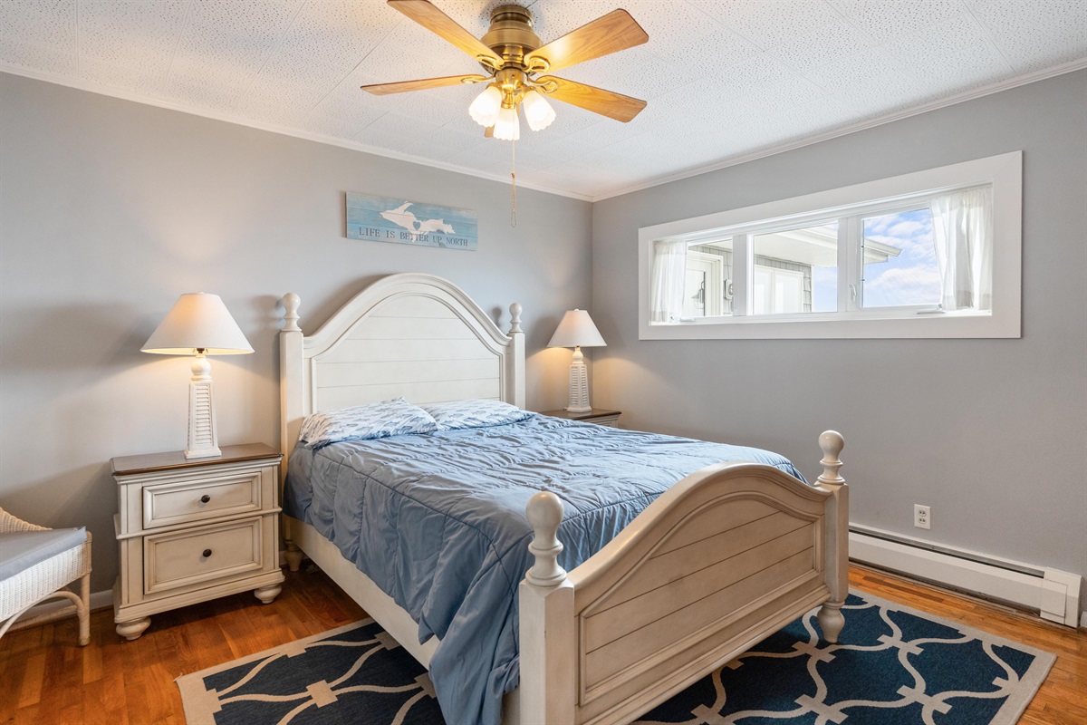 Bedroom 1 near the kitchen has a great view of the beach and lake