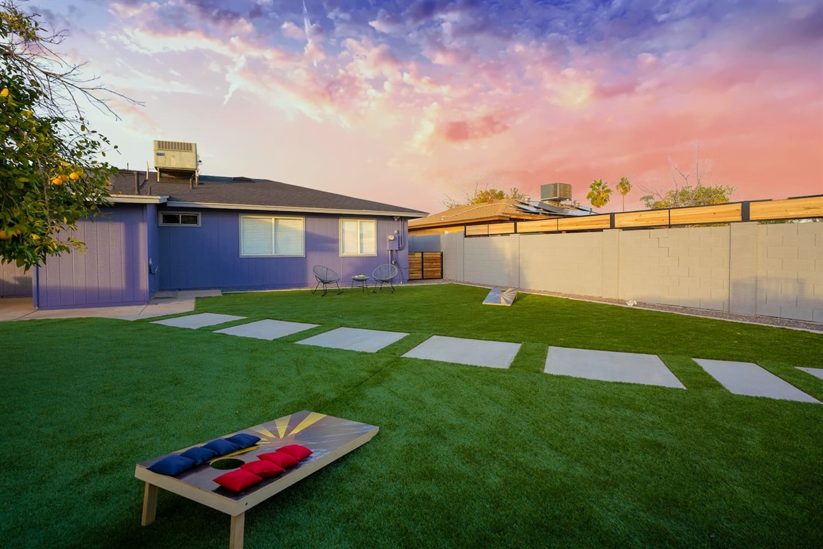 Corn hole game in the backyard for hours of fun.