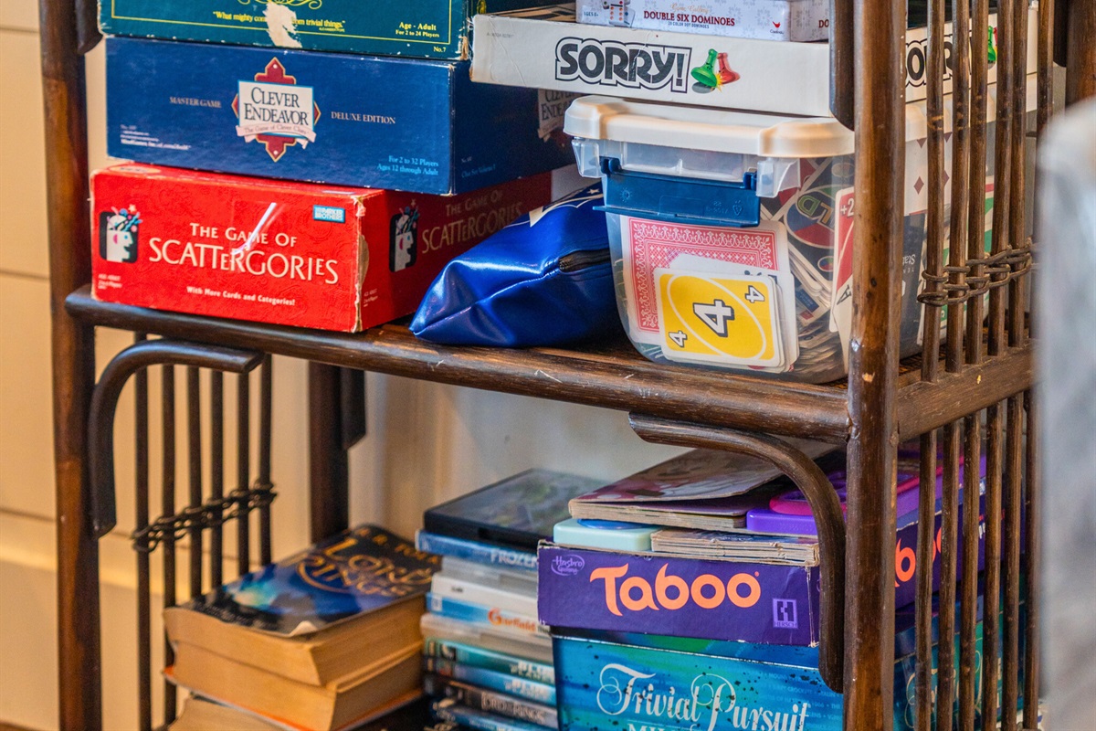 Board game shelf stocked for endless family fun and friendly competition.