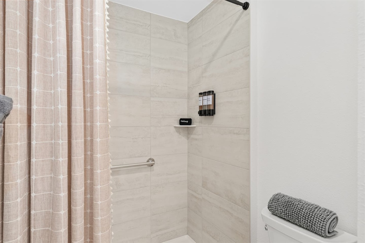 We have provided complimentary shampoo, conditioner and body wash in this master bathroom with spacious walk in shower.