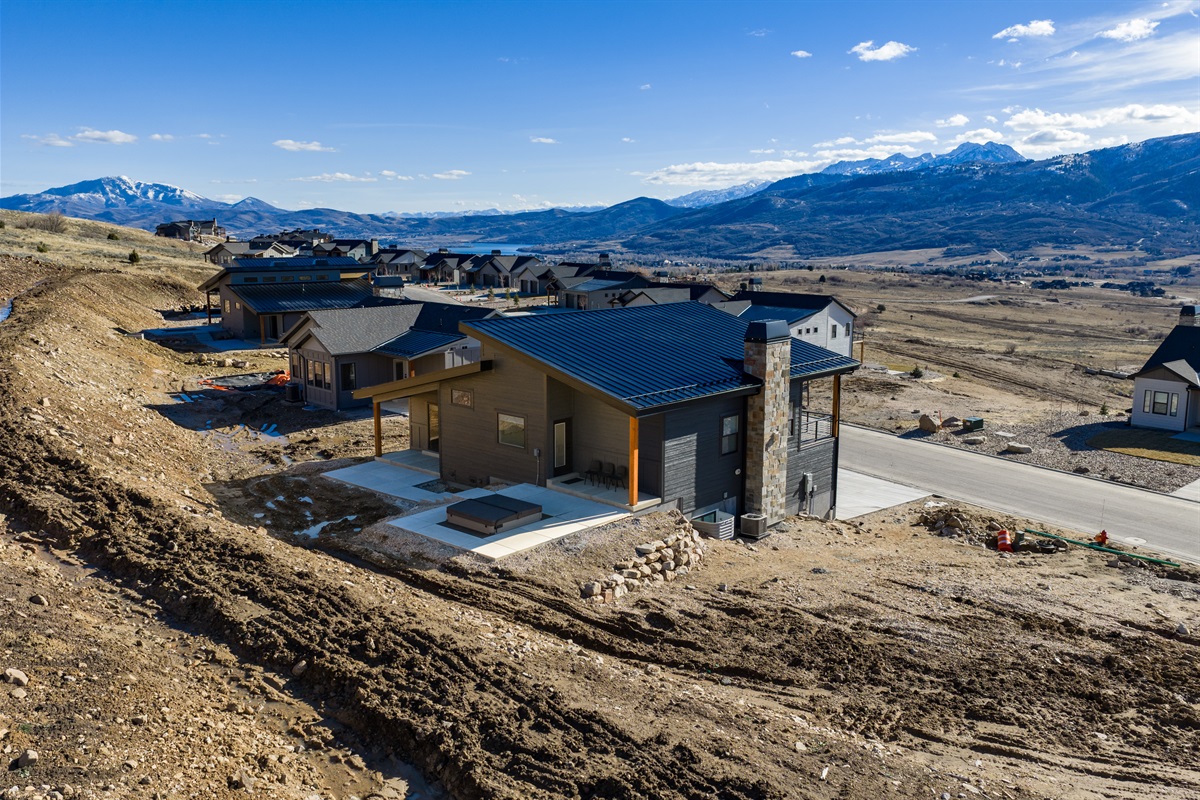 Aerial view of the Bridges home in Eden, Utah, showcasing its scenic hillside location.