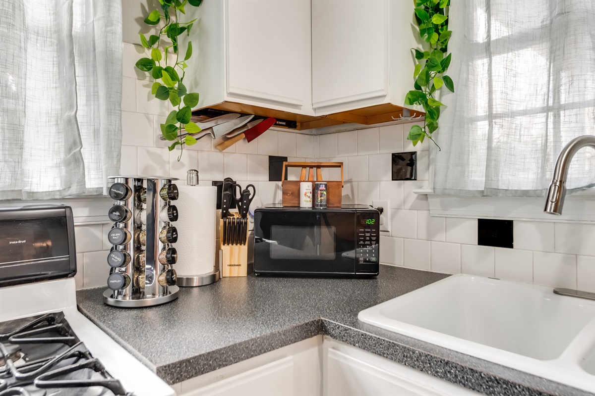 Kitchen Oasis: Cook up a storm with modern appliances and fresh greenery enhancing your culinary experience!
