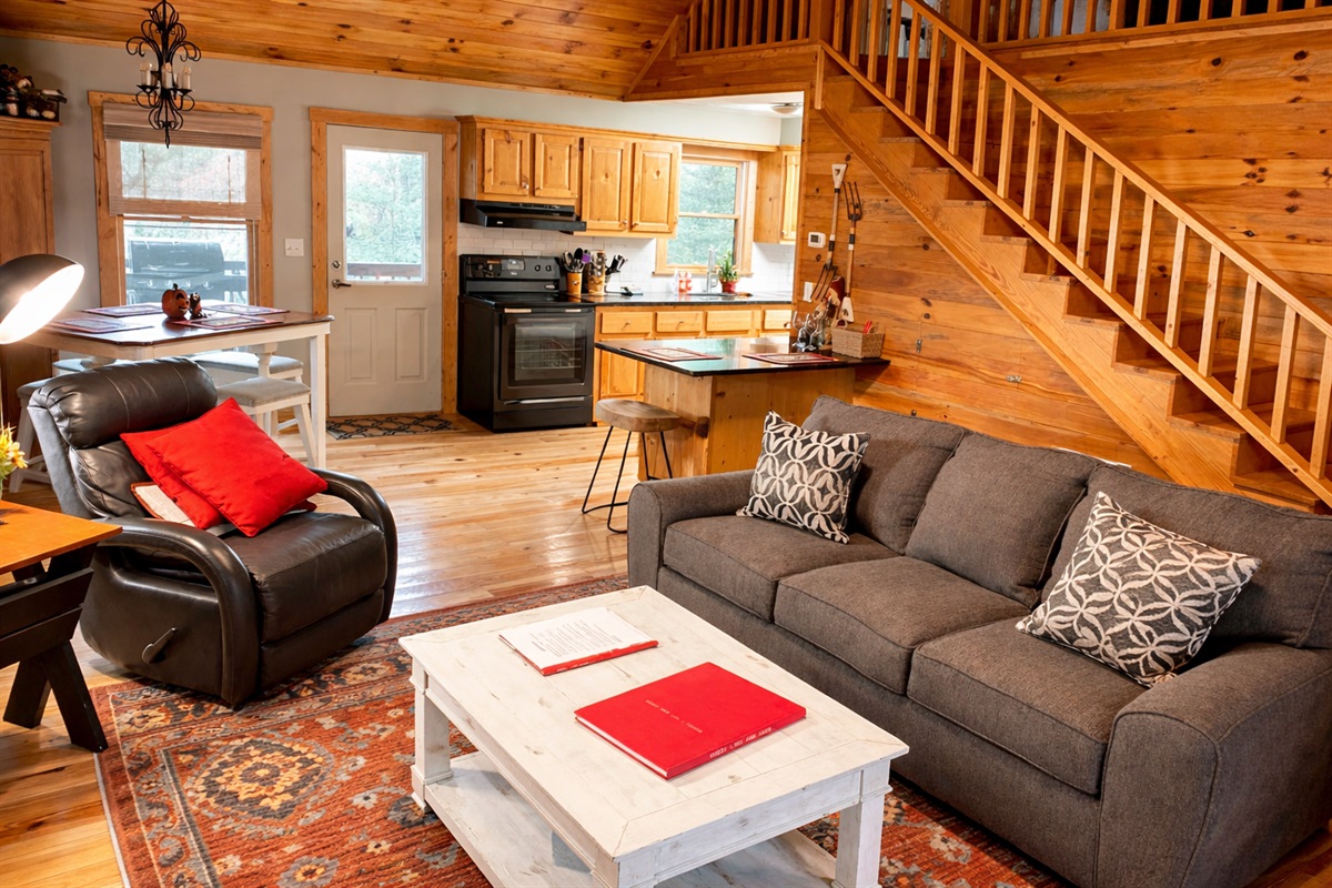Warm wood interiors, an open loft, and a cozy living space that flows seamlessly into the kitchen—perfect for relaxing after a day in the North Georgia mountains.