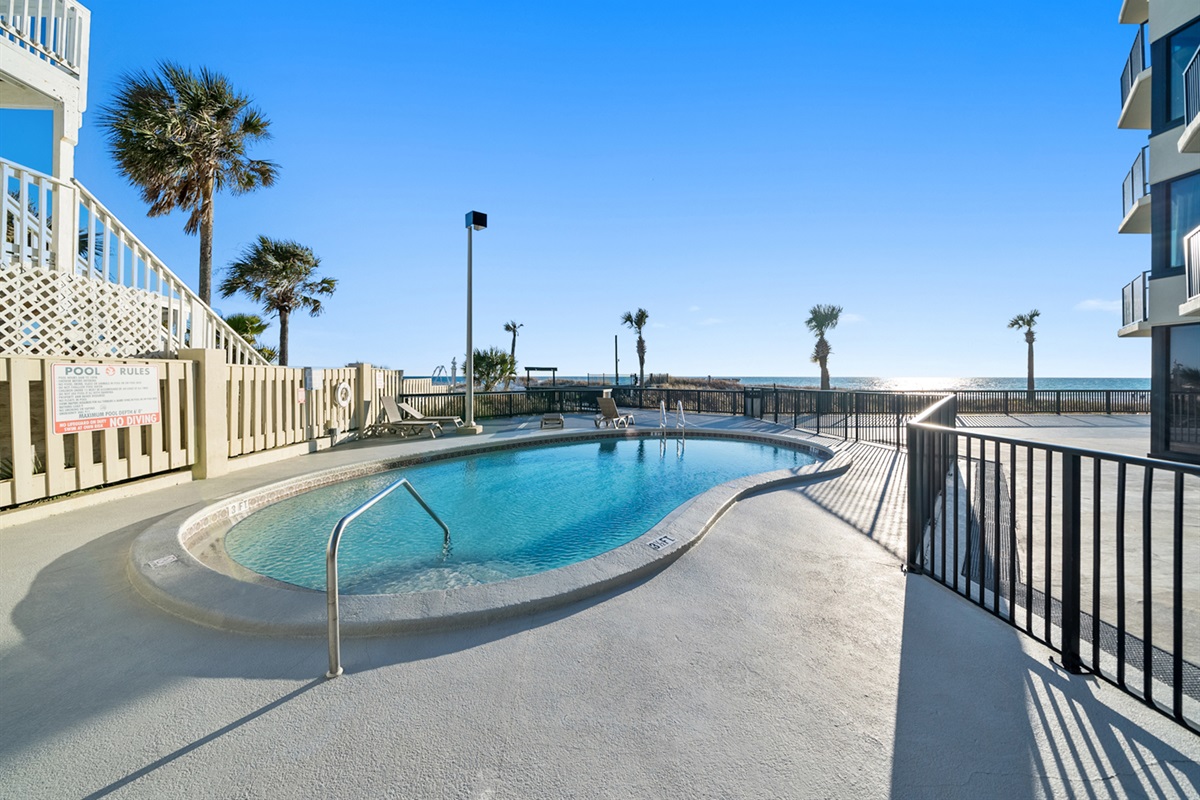 East pool deck w/private gated beach access.