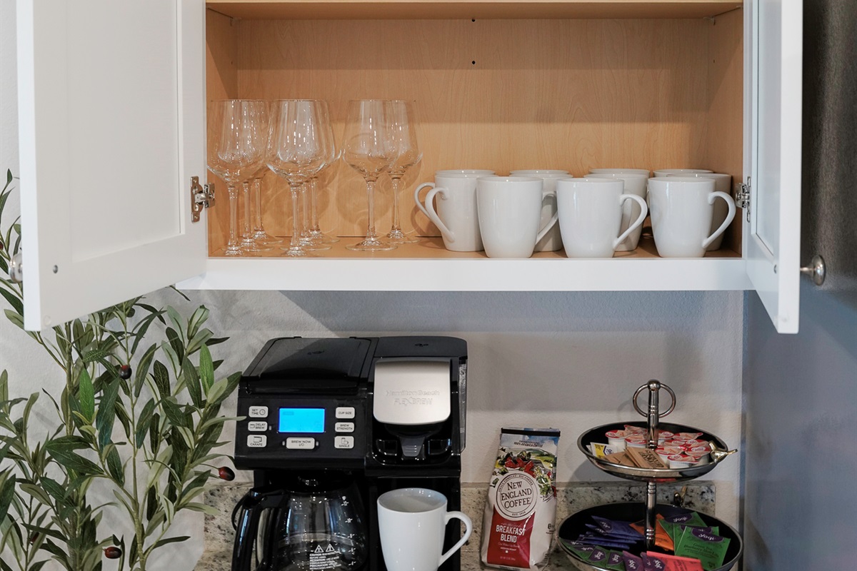 The coffee bar is stocked with tea, K-cups, and coffee grounds to get you started