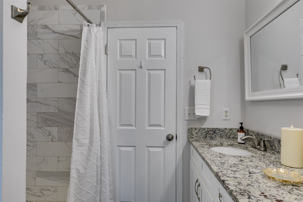 Wake up just steps from your own private connection — a shared spa-style bathroom linking both bedrooms, perfect for slow mornings and late-night chats.