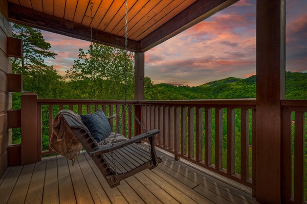 Swing, relax, and take in the mountains—just steps from your main-level king suite.