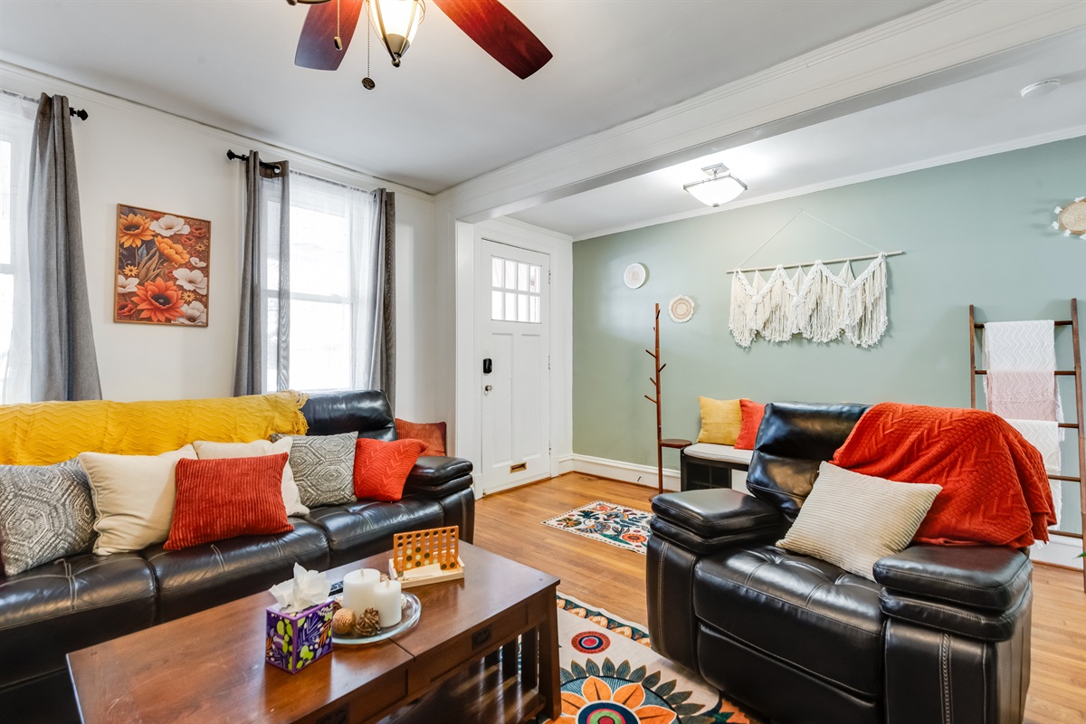 Living Room: Vibrant decor and plush seating create a welcoming space for relaxation and fun!