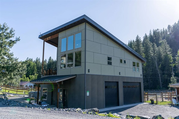 Exterior view looking southwest. Owner's person garage below guest house.