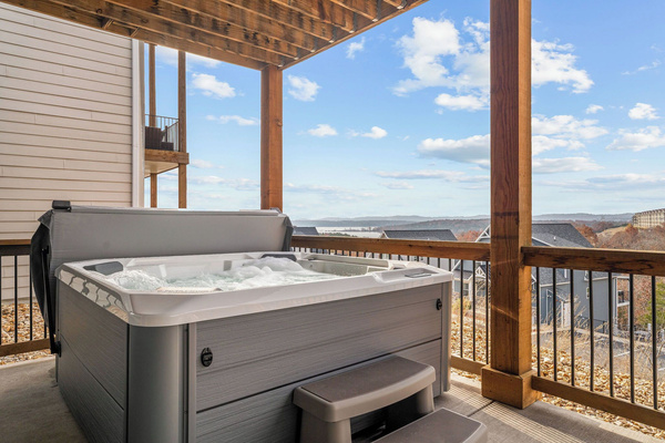 The brand new hot tub overlooks the lake