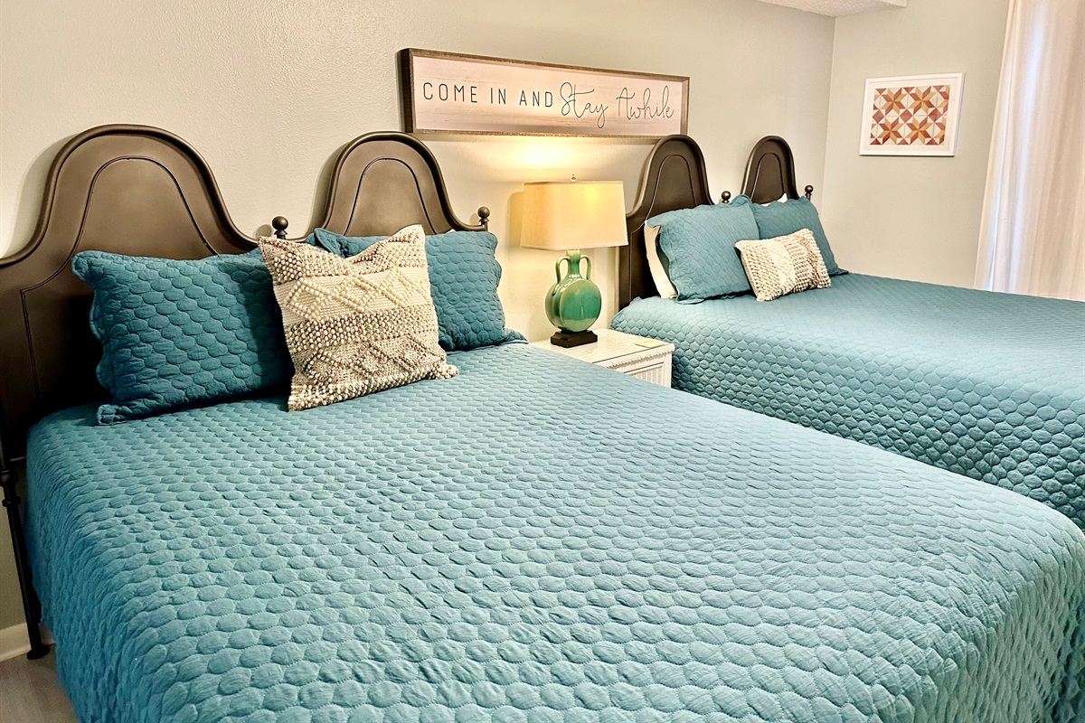 2 Queen sized beds in this guest bedroom!