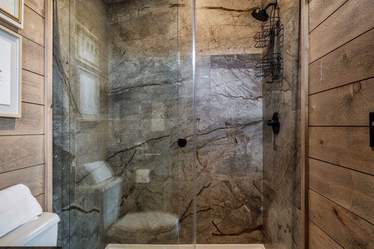 The floor to ceiling custom built tile shower in the Master is truly impressive 