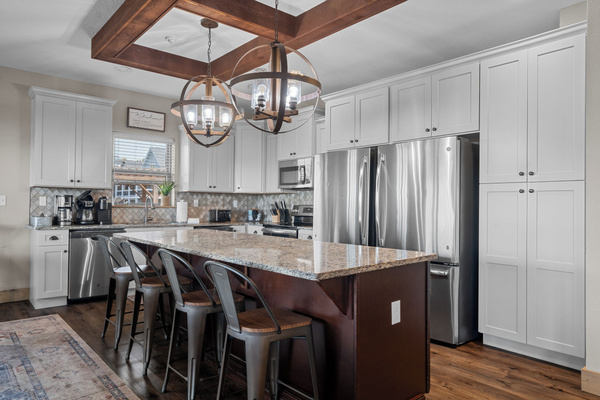 Main level kitchen. Two full-size refrigerators, two dishwashers, oven/ceramic glass cooktop, microwave, drip coffee maker, Keurig, and Nespresso. Stocked with small appliances, cookware, bakeware, utensils, dishes, glassware, mugs, and more!