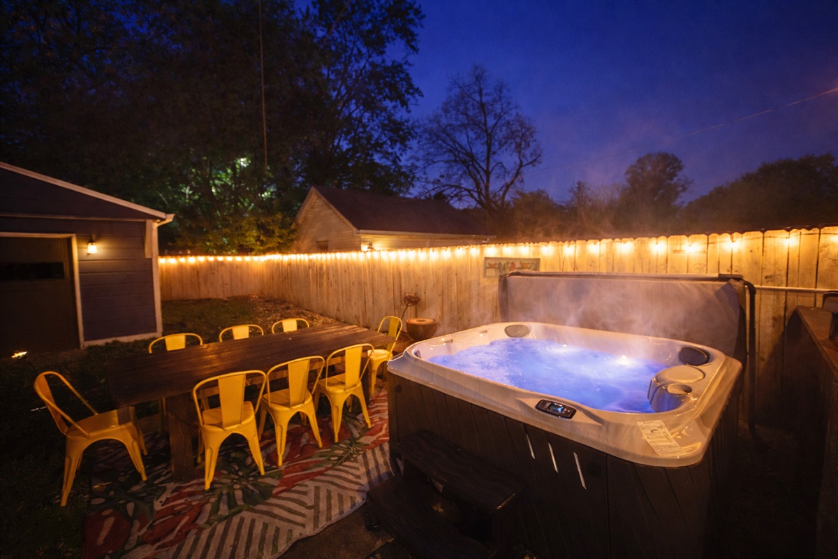 Soak under the string lights while the kids wind down — your private backyard escape!