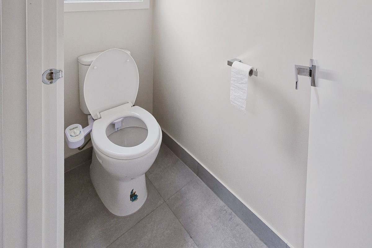 The main bathroom at Willows Stays Holiday gives the home a bright, practical space with a walk-in shower and double vanity.