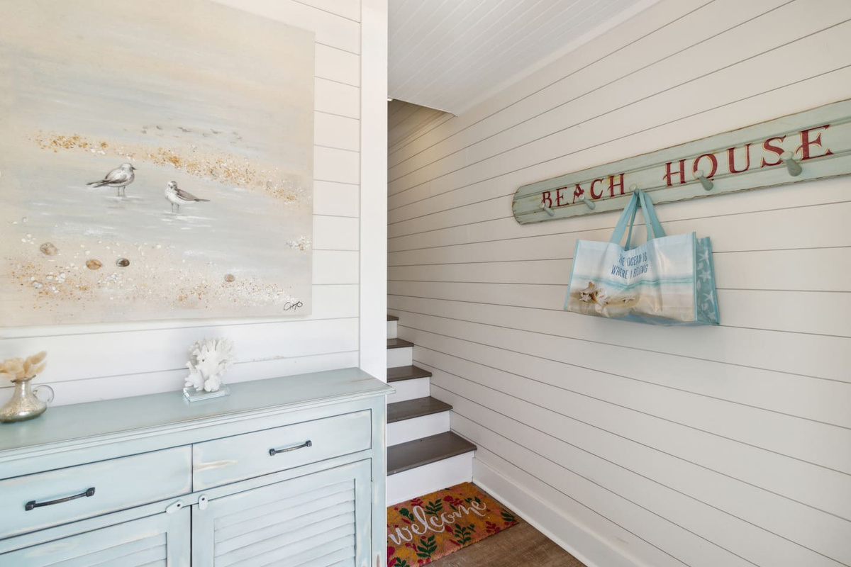 Drop your bags, hang your gear &mdash; the foyer entry has hooks and cabinet storage right at ground level.