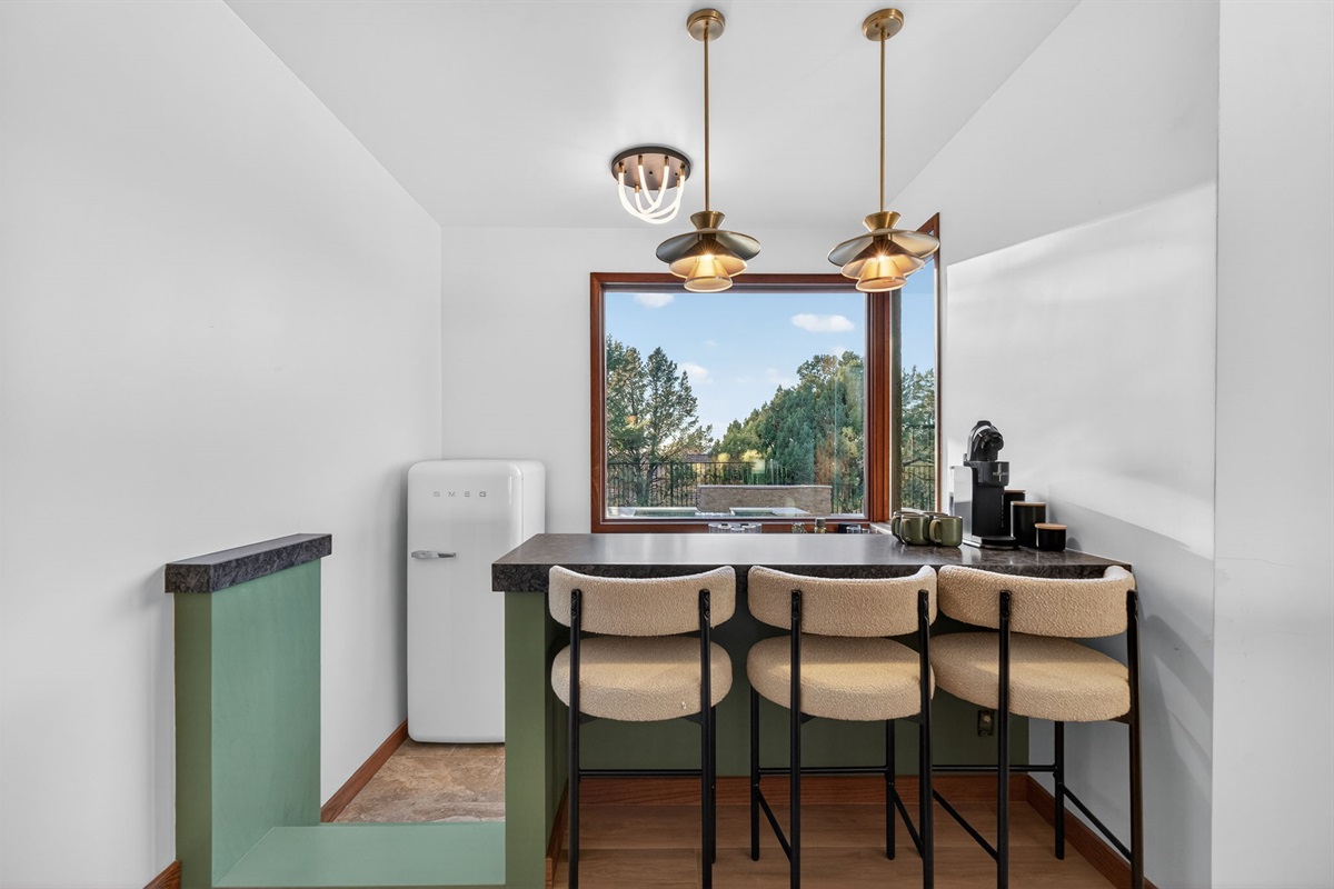 Downstairs bar- Start your mornings right—dedicated bar with seating and serene views. 