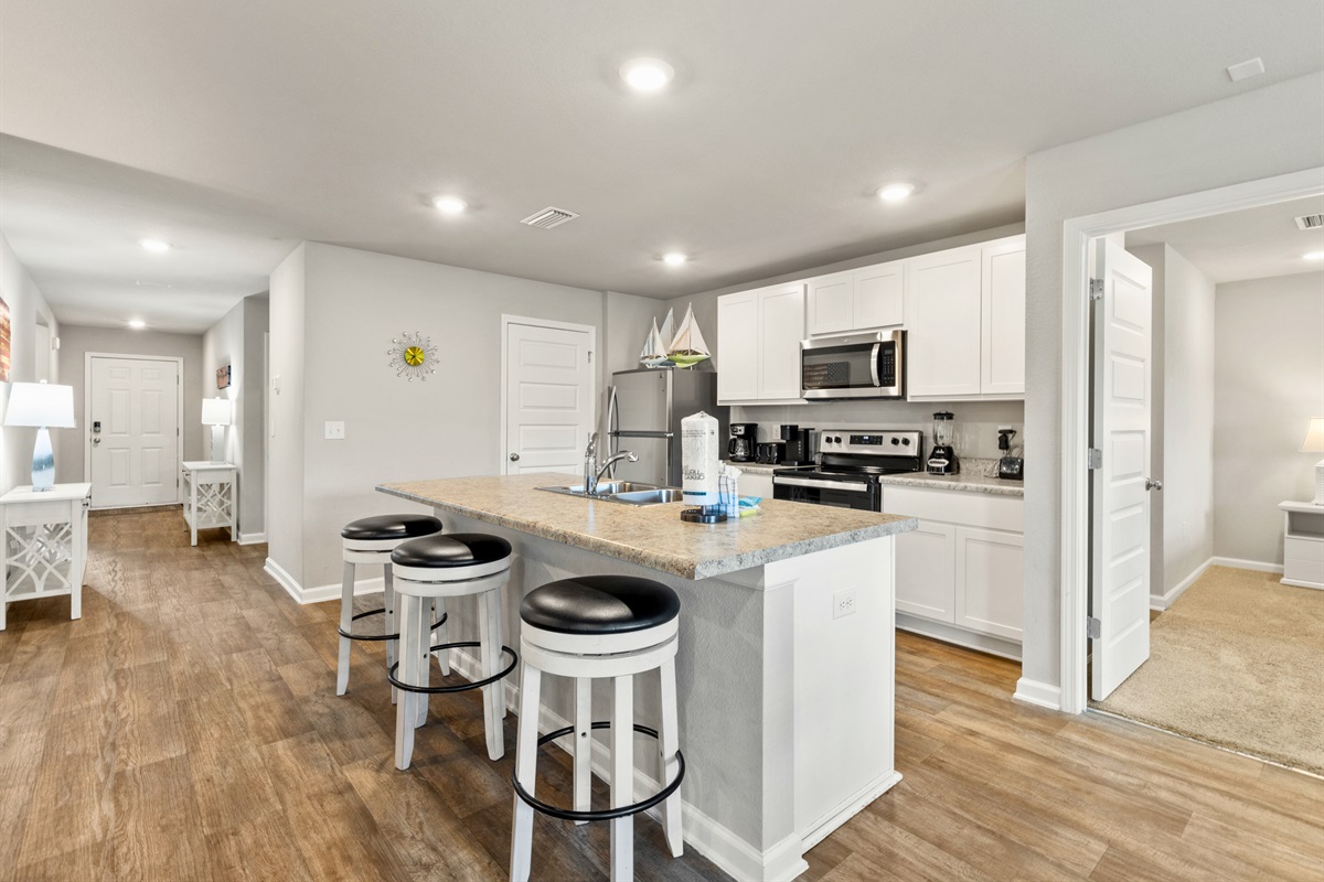 Open-concept living with kitchen, dining, and lounging all connected for family togetherness.