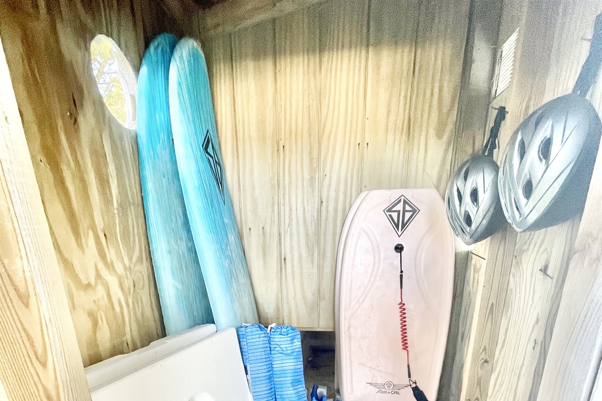 Beach chairs, umbrellas, surf boards, body boards, corn hole- outside guest locker