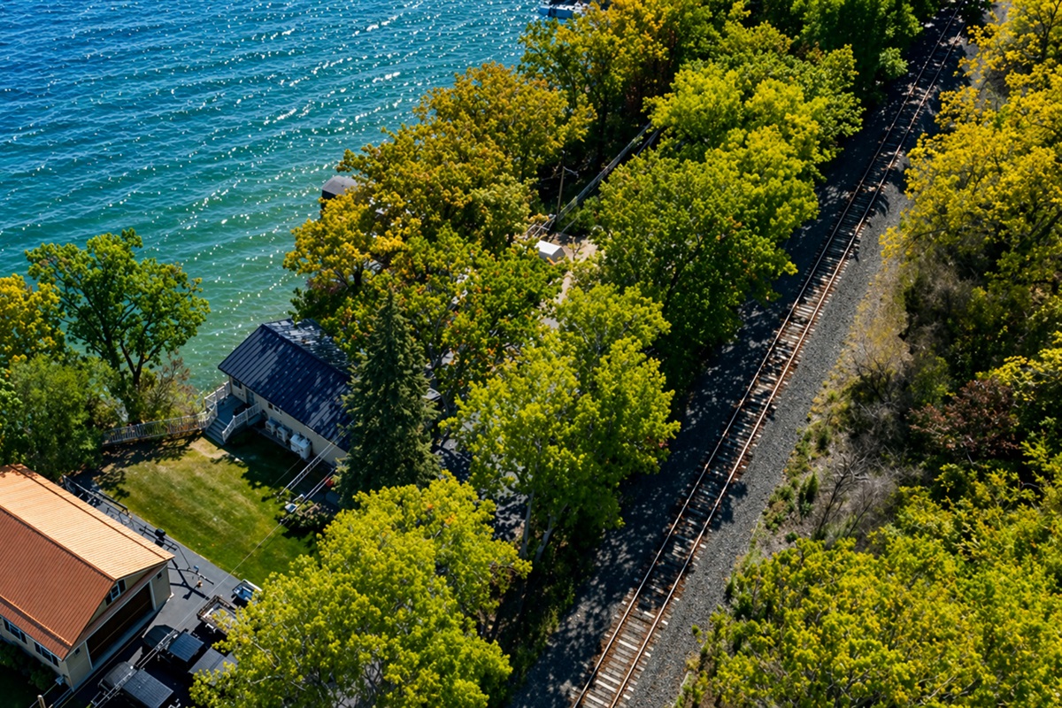 Peaceful lakeside retreat surrounded by lush trees—ideal for relaxing by the water