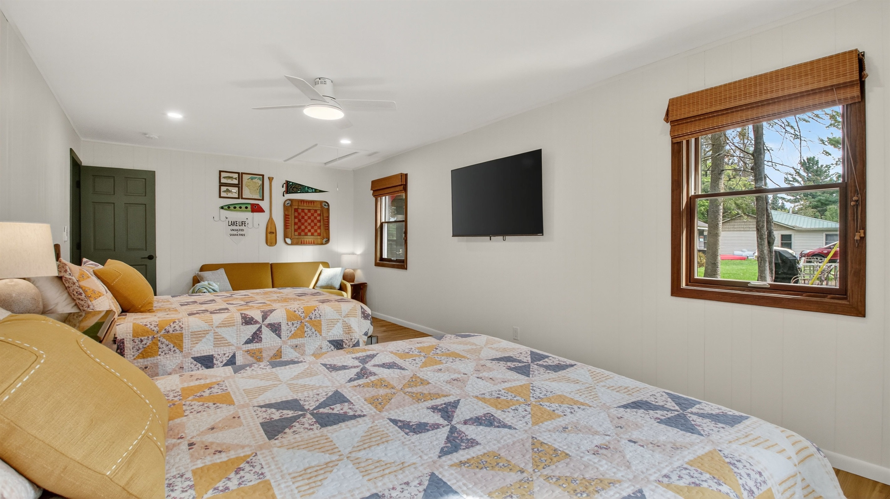 Two queen beds, Roku TV, and couch. This room has only a dresser for clothing storage.