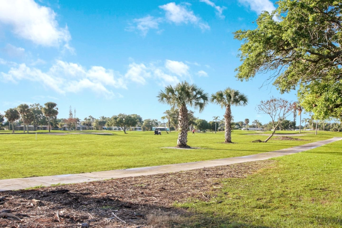View from the backyard overlooking the golf course at the Sandpiper Bay Resort.  Book tee times (carts and gear available) at sandpiperbaygolfclub.teesnap.net