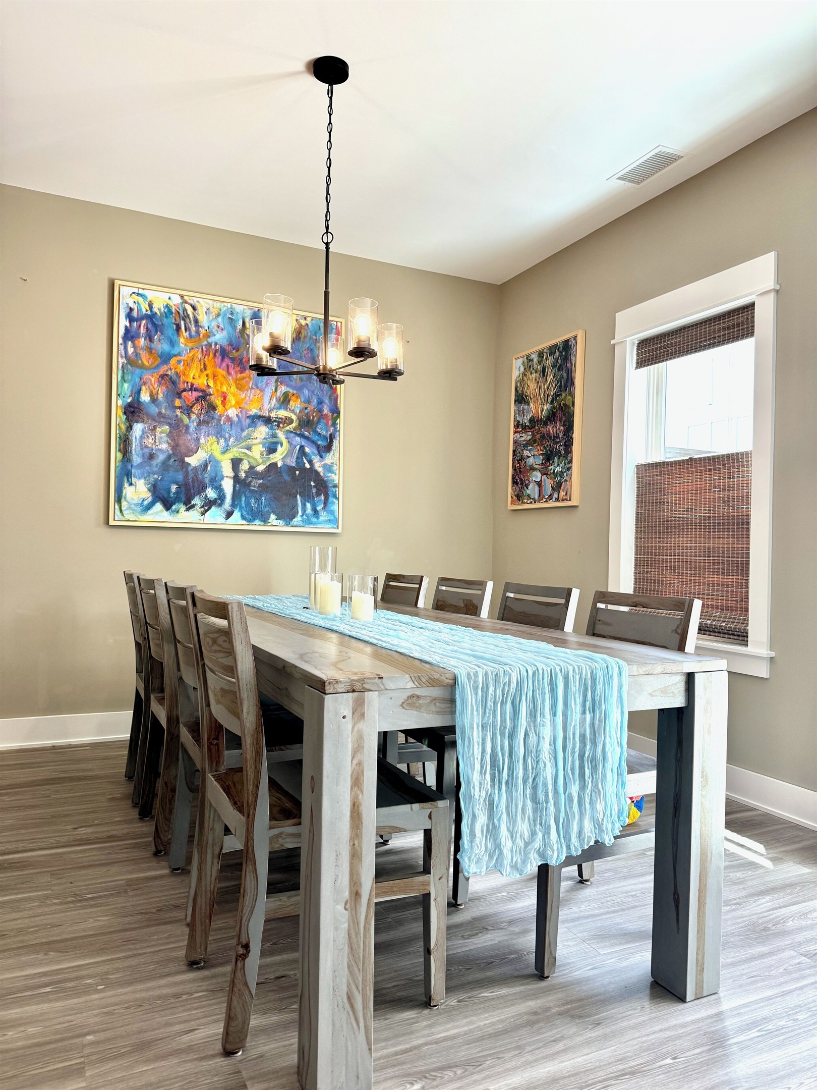 Dining table with seating for 8Dimmable chandelierOriginal art throughout