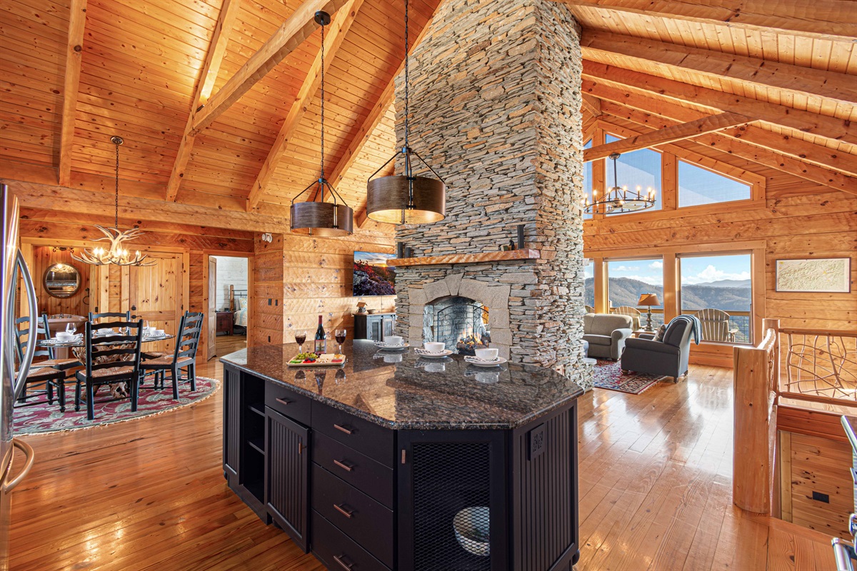 Kitchen: Stunning mountain views and modern comforts await in this wood-beamed haven!