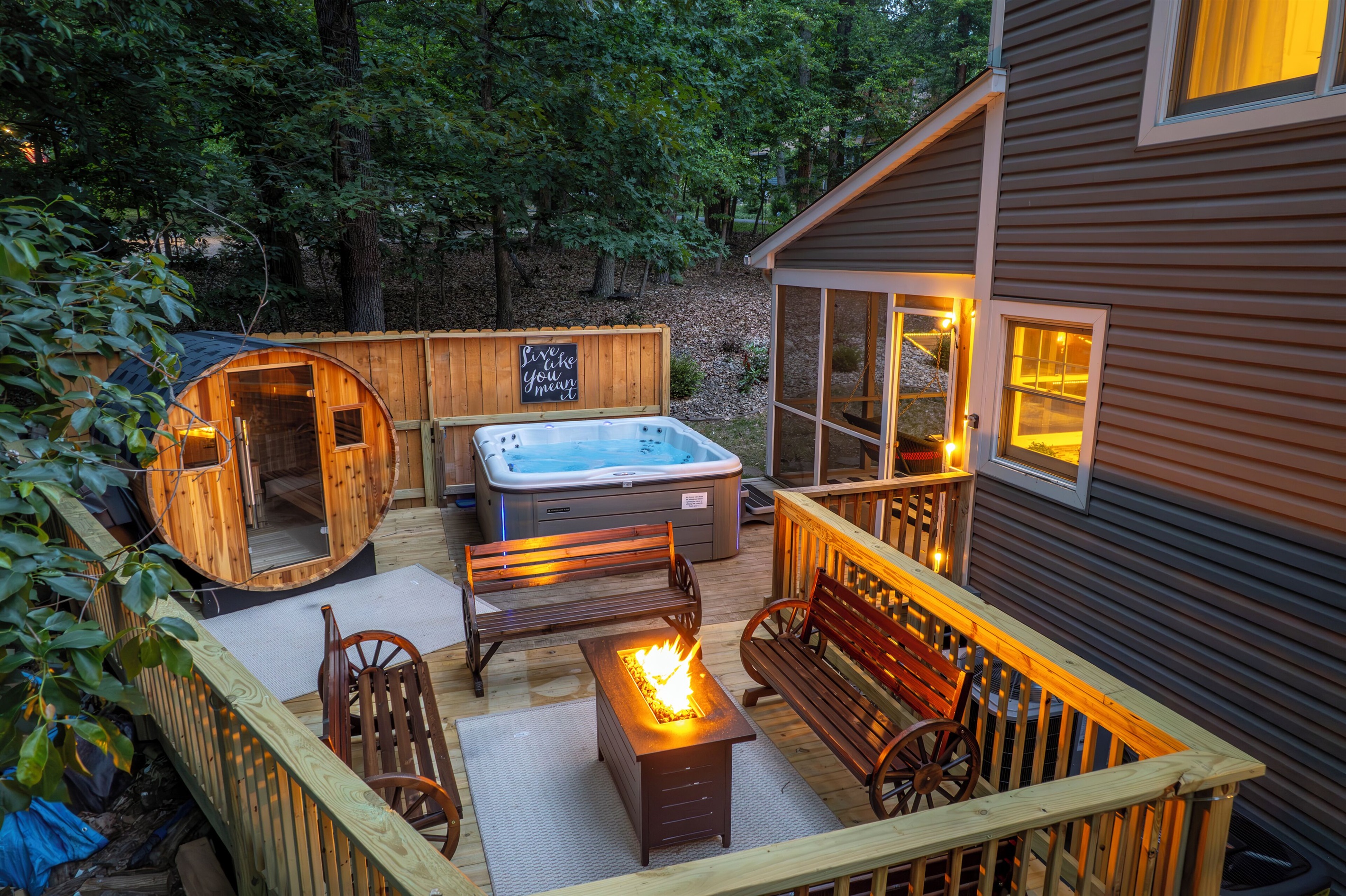 Deck with hot tub, sauna, and propane firetable / seating area
