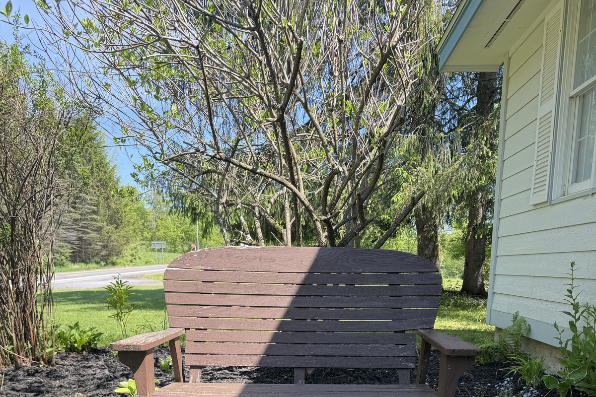 Bench to enjoy the gardens at Changing Seasons