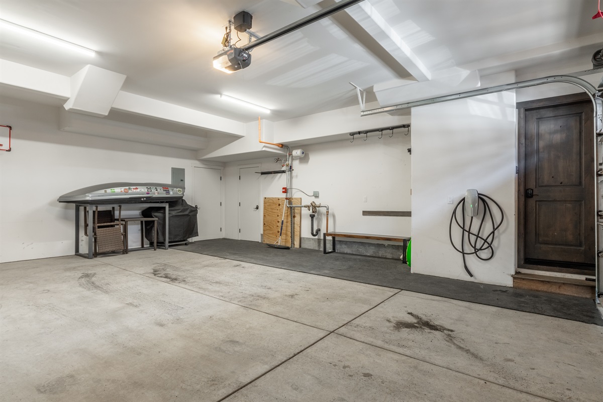 In addition to generous storage and parking, the garage includes a Tesla charger—making it simple to recharge both your gear and your vehicle between adventures.