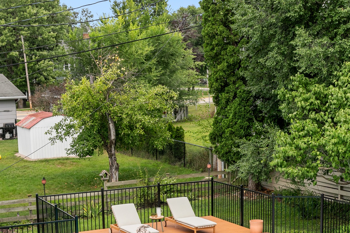 The pool area includes a spacious lounging deck, the perfect spot to stretch out, soak in the sun, and enjoy carefree afternoons by the water.