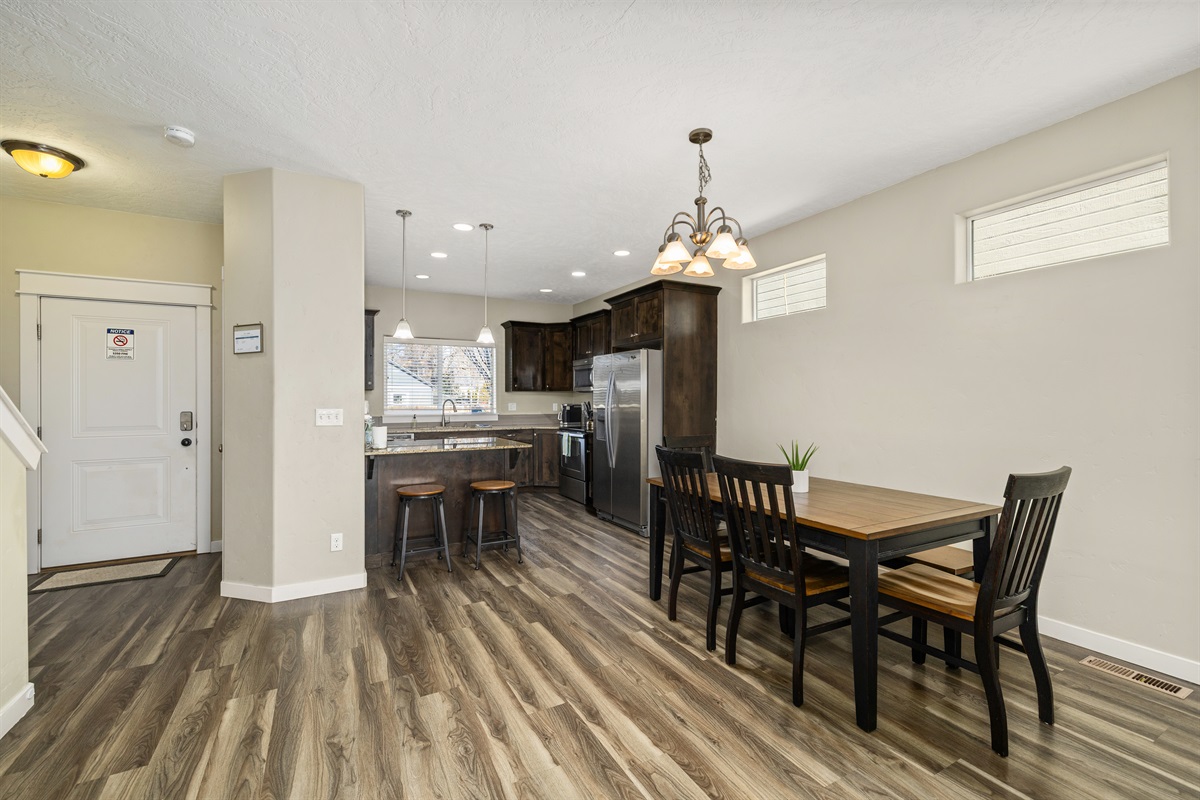 Home #2 view from living room to elegant and functional kitchen/dining area