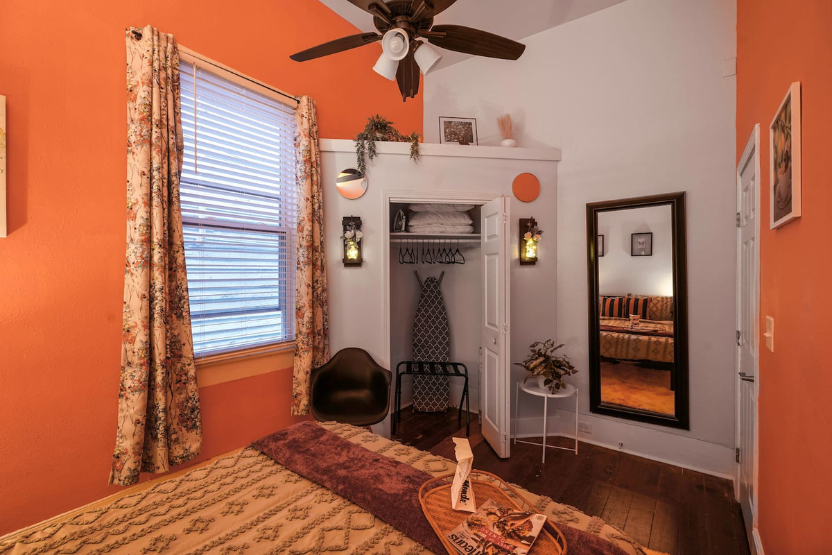 The Pink Room features a closet with extra pillows, hangers, ironing board, iron, and a pack ’n play for your little one.