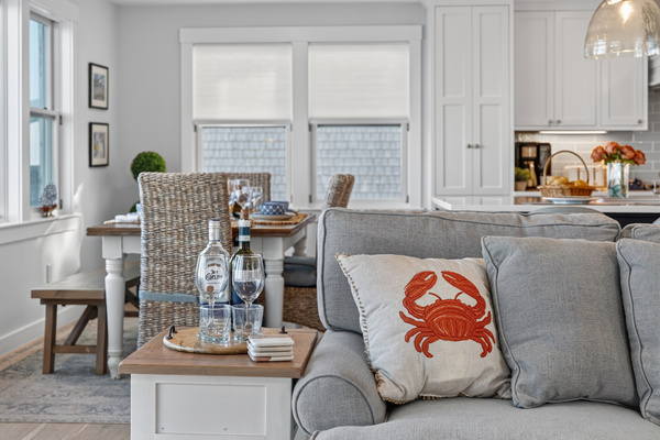 Comfortable seating area connecting the living room and dining space with ocean views