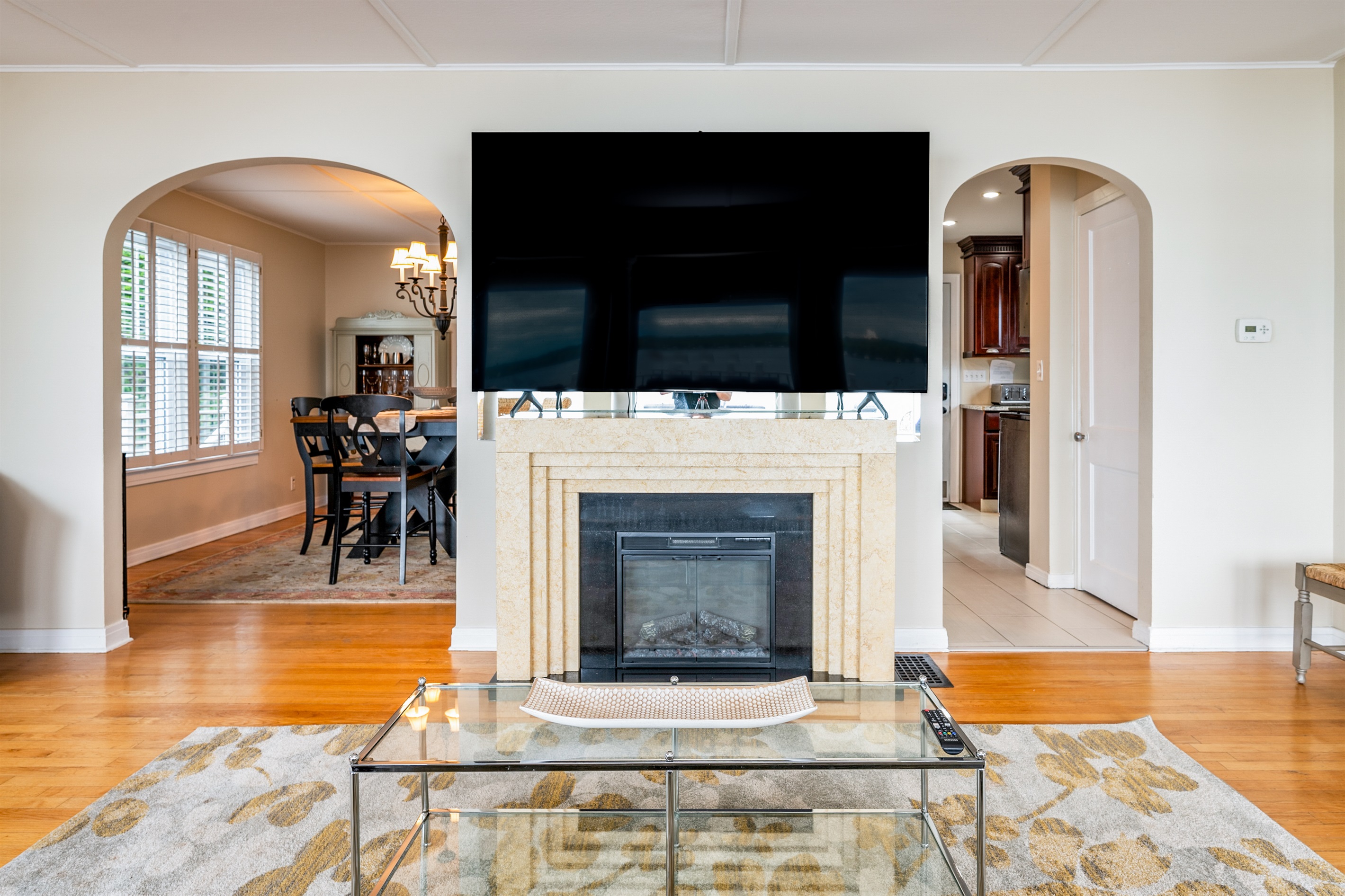 Relax in style with a large smart TV, elegant fireplace, and open layout perfect for gathering 🎬🔥🛋️