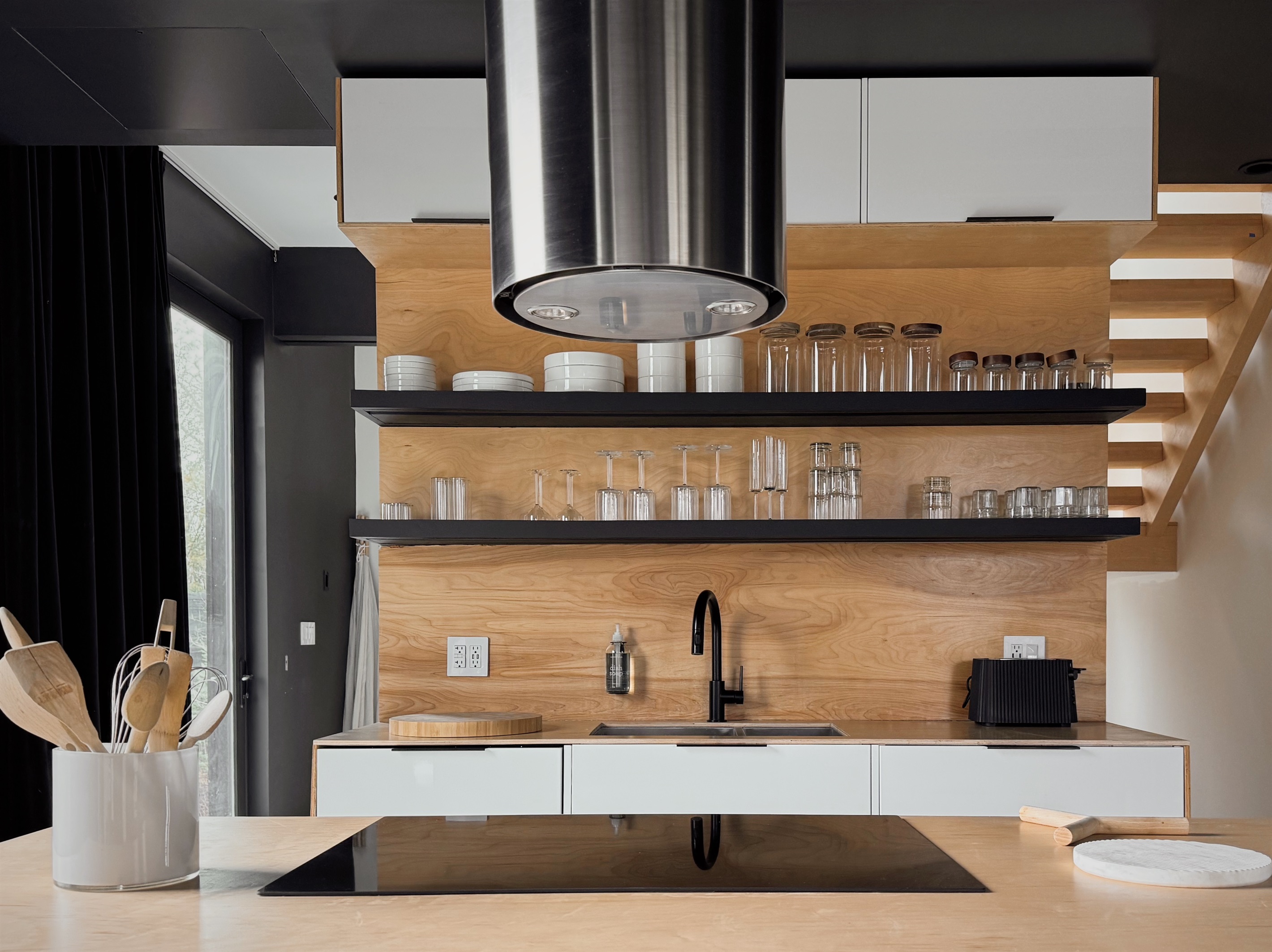 The induction stovetop in the open kitchen.