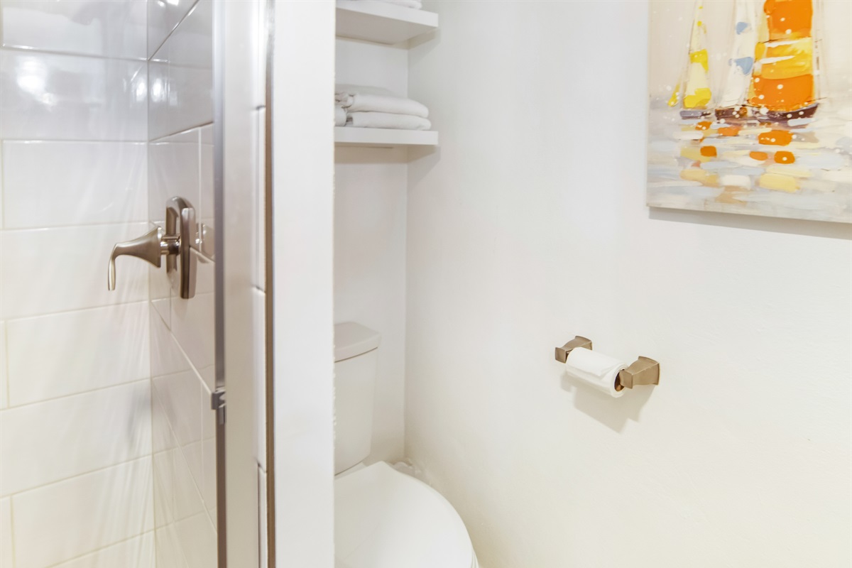 Thoughtfully designed bathroom with convenient storage to keep your stay organized and clutter-free.
