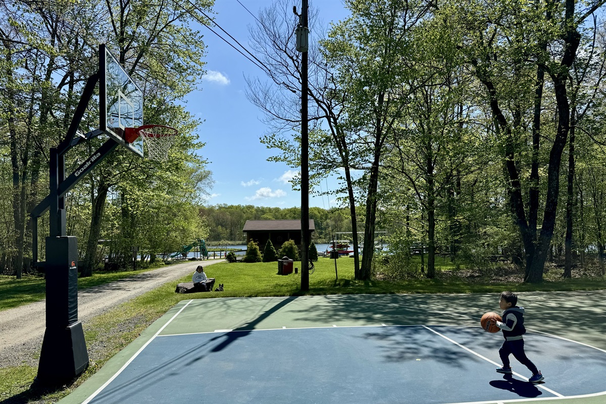 “Friendly hoops and forest air — time to shoot your shot.”
