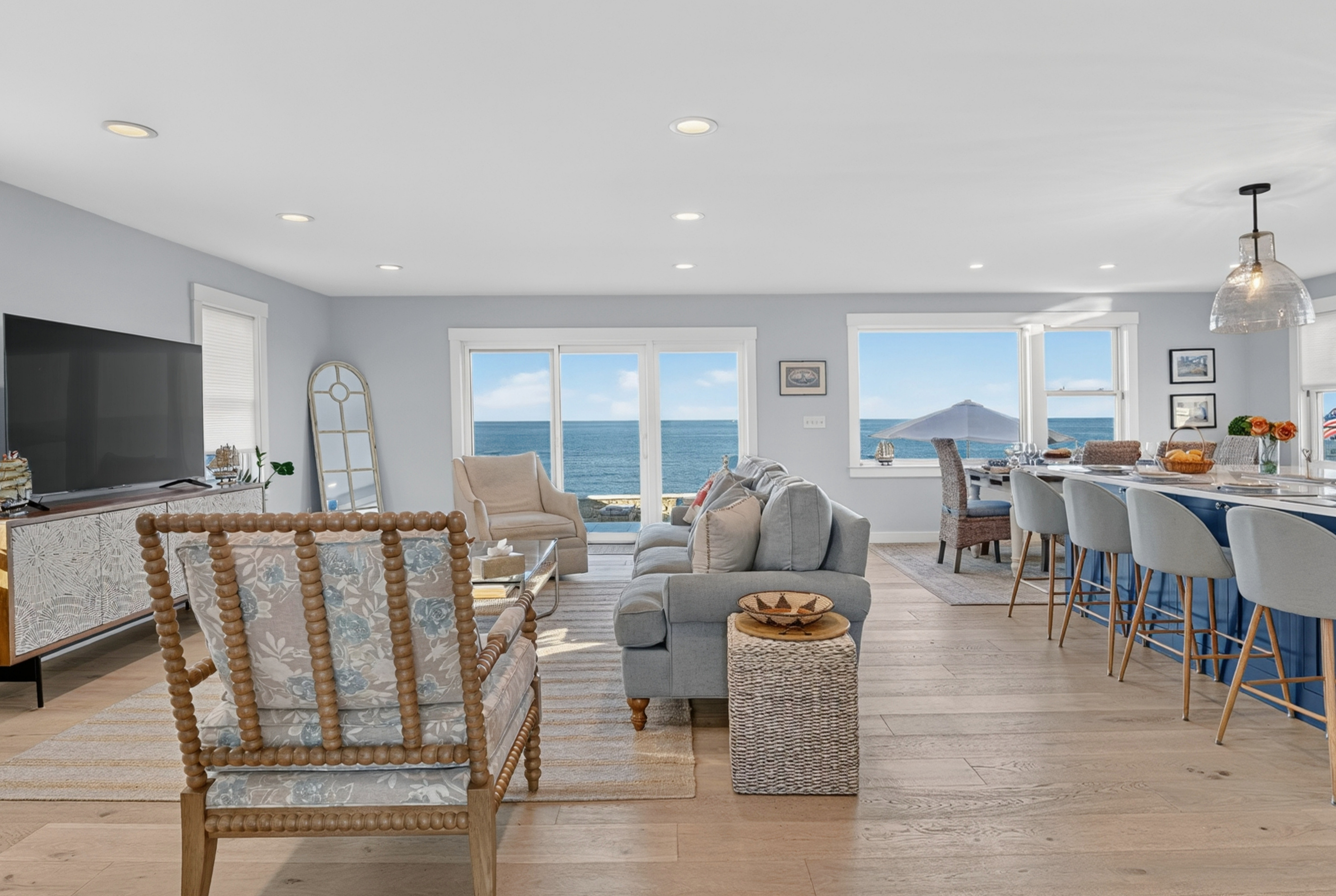 Spacious open living area designed for relaxing, dining, and entertaining by the water