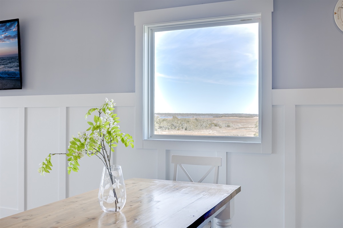 A peaceful dining nook with calming Sound views just outside the window
