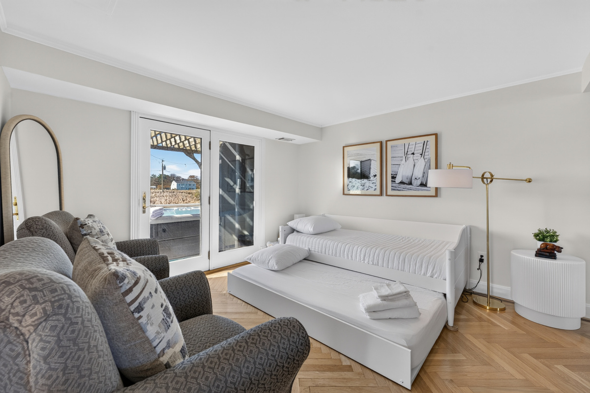 A peaceful, light-filled bedroom designed for comfortable nights and easygoing beach days.