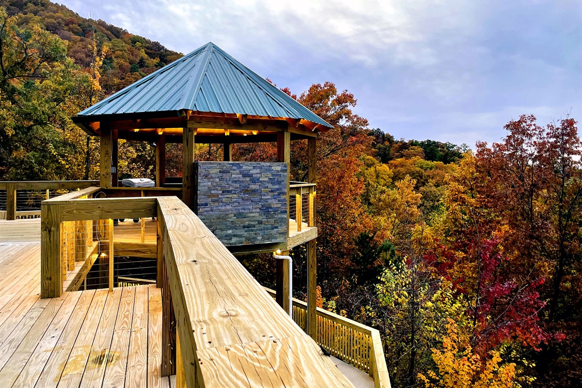 Outdoor kitchen with fireplace. Great place to socialize with stunning views