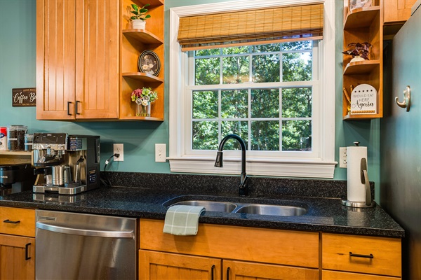 Even doing the dishes feels better here — enjoy the wooded view right outside the kitchen window.