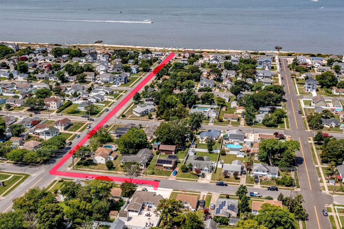See how close you are to the shore! This aerial view highlights the quick, easy route from your front door to the beach. Enjoy the ultimate convenience of a short walk to the water whenever the ocean calls.