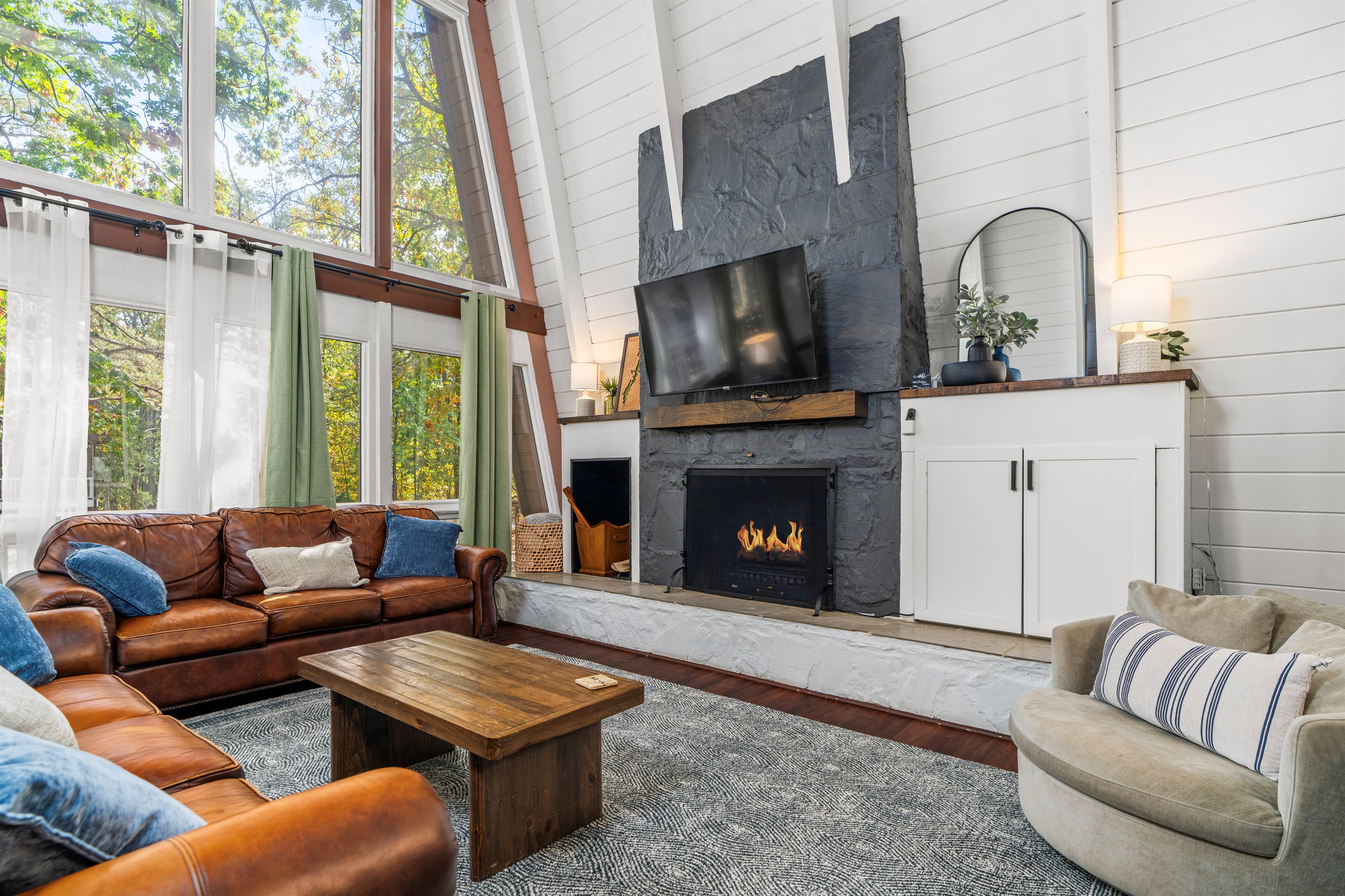 Enjoy the electric fireplace or cozy up for a movie on the big screen TV.