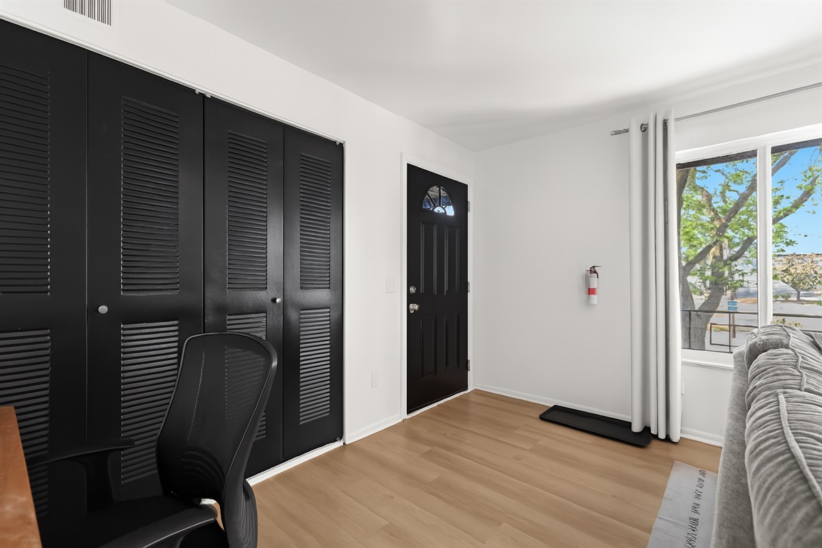 Entryway with chic black double doors and modern finishes—setting the tone as you enter your retreat.