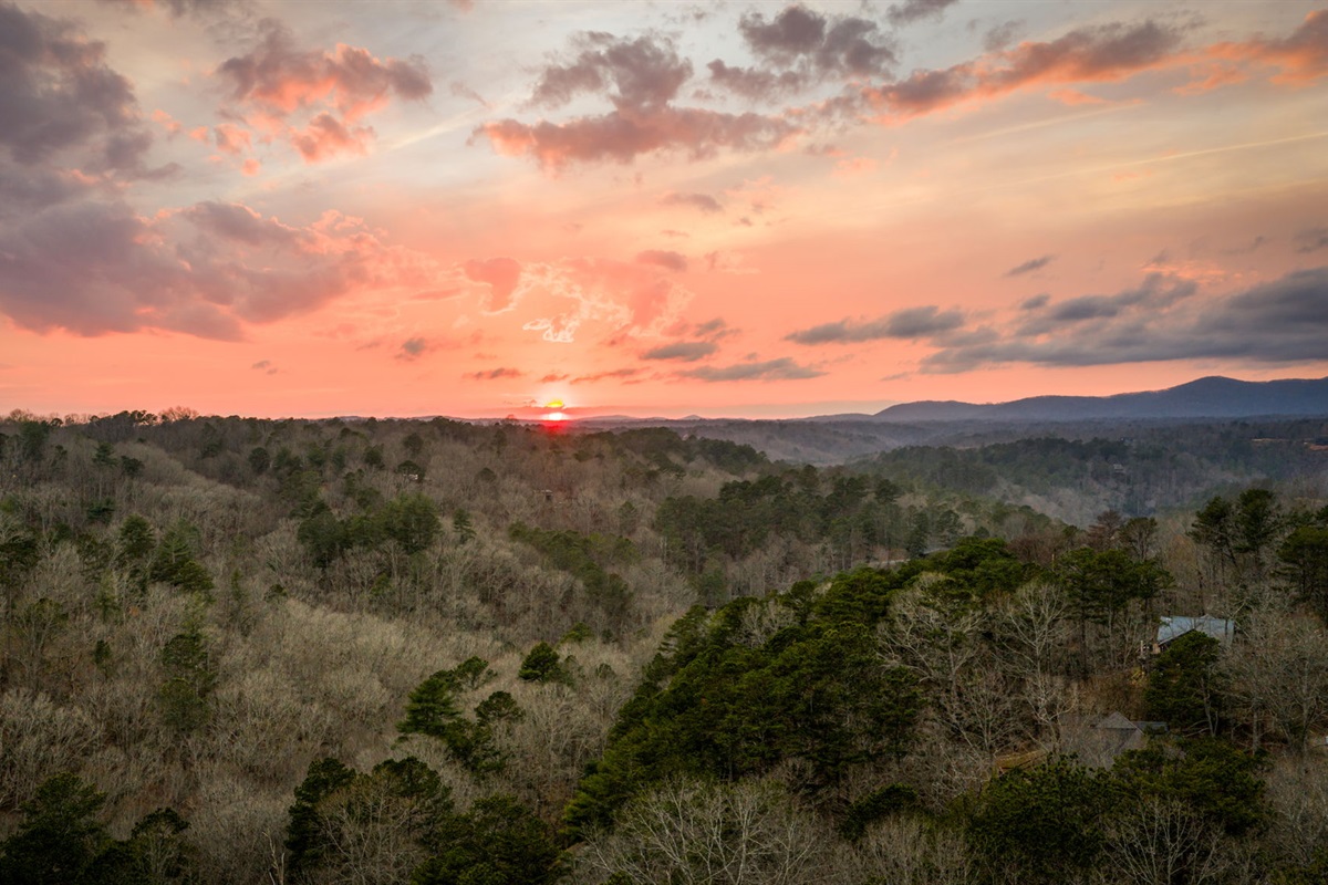 As the sun begins to set, warm golden hues fill the sky, enhancing the natural beauty of the scene.