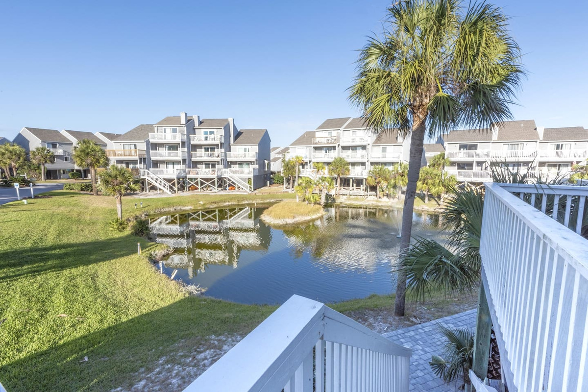 Walk down the deck stairs and the freshwater pond spreads out in front of you &mdash; ducks, herons, and a stillness you will not find on the beach side.